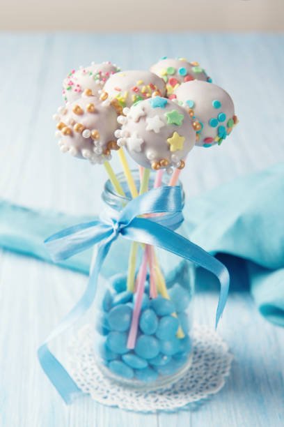 Homemade assorted cake pops with multi colored sprinkles in a bottle, sweet food ideas for kids
