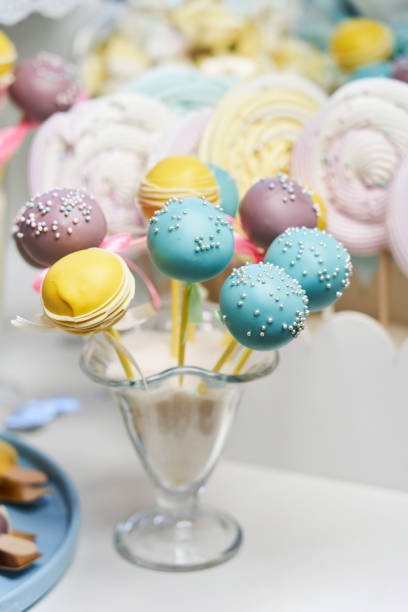 round sweets on sticks of different colors